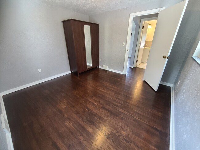 Bedroom with hardwood floor - 3122 State St