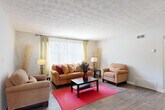 Located at 3901 Campbellton Rd SW in Atlanta, GA, this single-floor, 2-bedroom, 2-bathroom home offers a well-organized layout designed for comfortable everyday living. The spacious living room is a welcoming centerpiece, featuring hardwood-style flooring, a textured ceiling, and a large window with vertical blinds that floods the space with natural light. The adjacent dining area includes a ceiling fan, sliding glass door access to an outdoor balcony, and additional natural light, making it ideal for both casual meals and entertaining. The galley-style kitchen is efficiently arranged with white cabinetry, granite-look countertops, a gas range, dishwasher, and full-size refrigerator, providing ample storage and prep space. Both bedrooms are carpeted and generously sized, with the second bedroom featuring large windows, a ceiling fan, and a built-in closet with bifold doors. The two bathrooms are clean and functional, each equipped with a full soaking tub and tiled surround. A hallway connects the main living areas to the bedrooms and bathrooms, enhancing the home's practical flow. Hardwood-style flooring runs throughout the main living spaces, adding warmth and cohesion to the overall design.