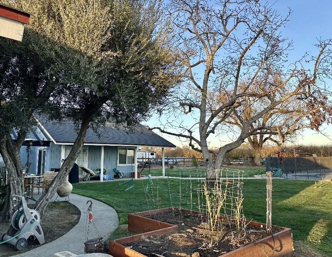Building Photo - COMING SOON - This stunning 5-Bedroom Home For Rent with Pool, Spa, and Spacious Grounds in a Pea...