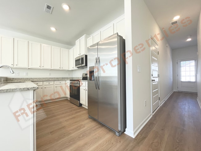 Building Photo - Move In by April 30 & Save $200/Month! Townhome Only $1,745! Regular $1,995 — Available NOW