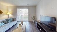 Located at 756 Westbrooke Village Dr in Manchester, Missouri, this single-floor residence offers a well-organized and functional layout across several distinct living spaces. The galley-style kitchen is outfitted with dark espresso cabinetry, stainless steel appliances including a refrigerator, dishwasher, and range, complemented by a mosaic tile backsplash and wood-style flooring that adds warmth throughout. The living room is bright and open, featuring rich hardwood-style flooring and a large sliding glass door with vertical blinds that flood the space with natural light and provide direct access to an outdoor patio area with greenery views. The two bedrooms are carpeted for comfort; one features dual sliding closets offering ample storage, while the second is a well-proportioned room with sheer curtains and tasteful wall accents. The full bathroom is finished with dark vanity cabinetry, a tub-shower combination, and wood-style flooring that ties cohesively with the rest of the home. The consistent use of dark cabinetry and warm flooring tones throughout creates a unified and modern aesthetic, making this a comfortable and practical living space in a desirable Manchester location.