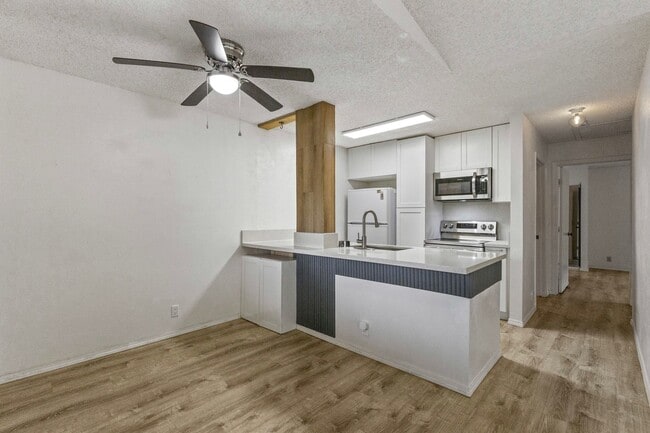 Building Photo - Luxury Living: 2-Bed Condo with 2 Parking Spots & Full Amenities!