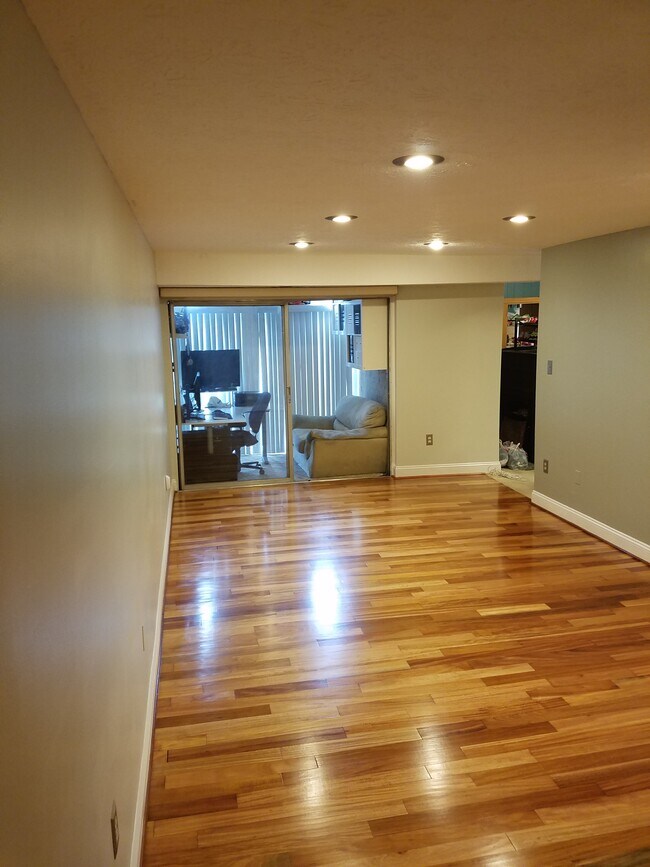 Living room facing office space/enclosed patio - 7929 Mandan Road