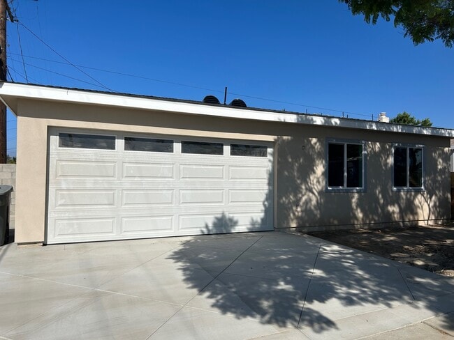 Front of house, currently has a white fence enclosing the property for privacy. - 2502 W 154th St House
