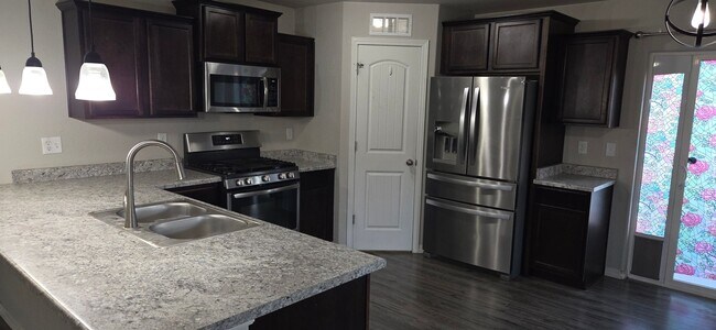 Building Photo - Falcon- Low Maintenance Ranch Style Home!