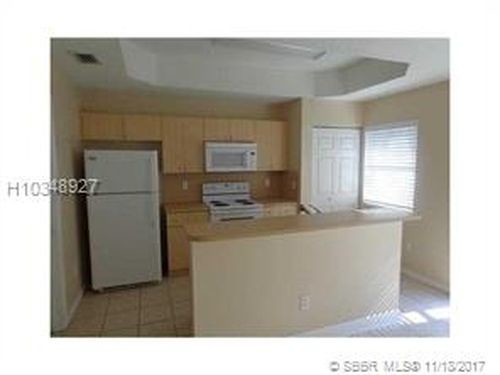 Building Photo - 4961 White Mangrove Way W
