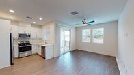 Located at 3310 W 84th St in Inglewood, California, this two-story residence offers a clean, modern design with thoughtfully appointed interiors across both floors. The main living area is open and airy, featuring durable wood-style flooring, recessed lighting, and a ceiling fan. Large windows dressed with horizontal blinds fill the space with natural light, while a sliding glass door provides direct access to a private balcony, seamlessly blending indoor and outdoor living.

The kitchen is well-equipped with crisp white shaker cabinetry, light quartz countertops, a stainless steel sink, and a full suite of stainless steel appliances including a refrigerator, range, microwave, and dishwasher. A convenient half bathroom on the lower level features a pedestal sink and wood-style flooring, ideal for guests.

Upstairs, the bedrooms are comfortable and well-lit, with ceiling fans and natural light from sizable windows. One bedroom features soft carpeting, while others continue the wood-style flooring. The upper-level full bathroom is generously sized, offering a white vanity with quartz countertop, a glass-enclosed shower, and high transom windows. An additional bathroom with a vanity, tub-shower combo, and gold-tone fixtures rounds out the upper level with refined detail.