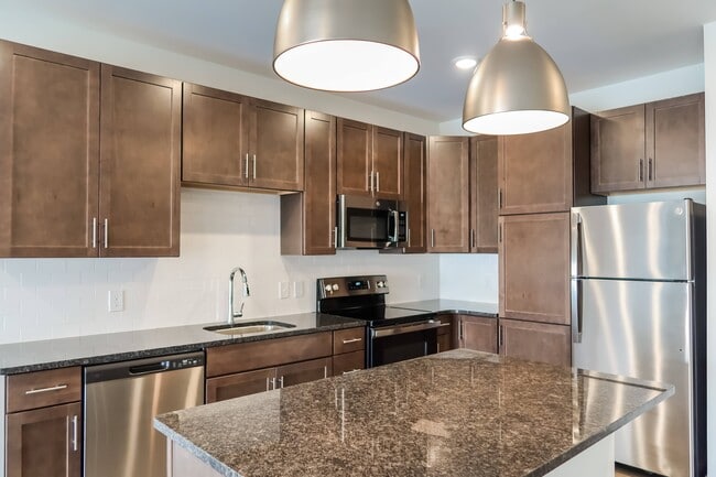 Large Chef-Ready Kitchens with Dark Cabinets, Pantries, and Stainless Steel Appliances - Madamore
