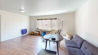 Located at 5619 5th Ave in Pittsburgh's Shadyside neighborhood, this two-bedroom, one-bathroom unit offers a practical and comfortable single-floor layout. The living room is a welcoming, open space featuring warm hardwood flooring and a large window that invites natural light, creating a bright and airy atmosphere. A hallway connects the main living areas to the bedrooms, maintaining a clear and functional flow throughout the unit. The galley-style kitchen is efficiently designed with warm wood cabinetry, granite-look countertops, a gas range, dishwasher, and a window above the sink, making it both practical and well-appointed. The primary bedroom is a generously sized room with hardwood floors, a window with neighborhood views, and closet access, offering a comfortable personal retreat. The second bedroom is a cozy, well-proportioned space with hardwood flooring and its own closet. The bathroom showcases retro charm with classic pink wall tiles accented by dark border tiles, a pedestal-style sink, a mirrored medicine cabinet, and a shower-tub combination — a nod to the building's vintage character. Throughout the unit, consistent hardwood flooring and neutral walls provide a cohesive, understated aesthetic suited for a variety of lifestyles.