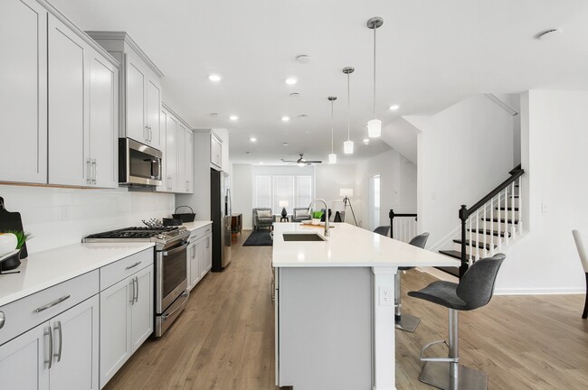 Large Kitchen with Undermounted Sink on Island - Greystone Suwanee