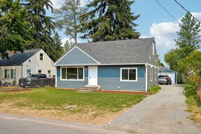 Building Photo - Updated Home with Large Detached Garage & Off-Street Parking