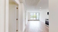 Located at 1202 Harwood Street in Vancouver's vibrant West End neighbourhood, this thoughtfully updated two-bedroom, one-bathroom unit offers a clean, modern aesthetic across its single floor. Light wood laminate flooring flows consistently throughout, creating a bright and cohesive feel in every room.

The open-concept kitchen and living area serves as the heart of the unit. The kitchen is well-appointed with white shaker-style cabinetry, a white subway tile backsplash, stainless steel appliances including a gas range, built-in microwave, dishwasher, and full-size refrigerator, complemented by matte black hardware and fixtures. Recessed lighting illuminates the space efficiently.

Both bedrooms are bright and functional, each featuring large windows that allow ample natural light and views of the surrounding cityscape. Baseboard heating runs beneath the windows, and the primary bedroom includes a mirrored sliding-door closet, offering practical storage. The second bedroom benefits from a large sliding glass door that opens to a balcony with lush tree views.

The bathroom is finished with white subway tile surrounding a full soaker tub, accented by sleek matte black fixtures, maintaining the unit's consistent modern design language throughout.