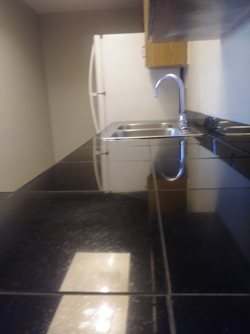 Kitchen view from pass-thru - 300 N Dewey St