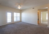 Located at 527 Jason Ave in Amarillo, TX, this single-story home offers a practical and comfortable layout with well-defined living spaces throughout. The open-concept living and dining area is finished with plush carpeting and features a ceiling fan with light fixture, providing comfort and functionality. Large windows allow generous natural light to fill the room, and a door leads directly to an outdoor area. The living space flows seamlessly into the kitchen, which is separated by a peninsula-style breakfast bar. The kitchen is equipped with white cabinetry accented by wood trim, a gas range, built-in microwave, dishwasher, and a double-basin sink, all set atop warm hardwood-style flooring. Additional bedrooms are carpeted and receive ample natural light through large windows with blinds. Each bathroom features hardwood-style flooring, a vanity with storage cabinetry, and a full tub-shower combination with a tiled surround accented by a classic checkered border. Ceiling fans are present in multiple rooms, enhancing airflow and comfort throughout. The home's neutral color palette and clean lines create a bright, move-in-ready atmosphere suited to a variety of lifestyles.