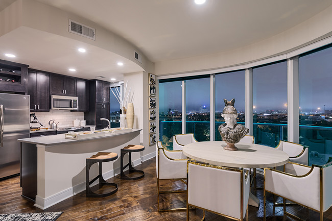 Kitchen Living room with stunning views, hardwood flooring and floor to ceiling windows - One Uptown