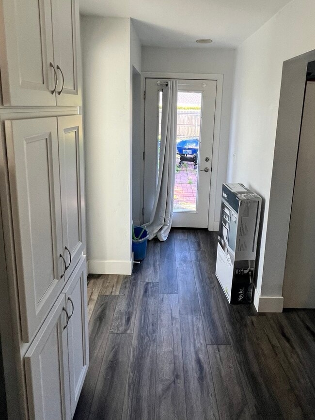 Full Light door off private parking/yard space, enter off alley. Gate security and greenery. - 4960 34th St