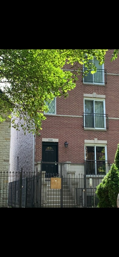 Front of building with locked gate - 1241 N Maplewood Ave