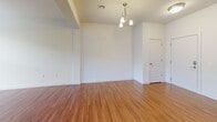 Located at 3214 Dunlap Ln in Mechanicsburg, PA, this well-designed single-floor home offers three bedrooms and three full bathrooms across a comfortably sized floor plan. The living area welcomes you with rich hardwood-style flooring, large windows that invite natural light, and a front entry with direct outdoor views of the surrounding neighborhood.

The kitchen is a standout feature, showcasing rich dark wood cabinetry, granite countertops, a large center island with a double sink, stainless steel appliances, and pendant lighting — creating a functional and stylish space for cooking and entertaining.

The primary bedroom is generously proportioned, finished with plush carpeting and a ceiling fan for year-round comfort, and includes access to a dedicated walk-in closet with wire shelving systems for ample storage. The secondary bedrooms are equally well-sized with soft carpeted floors and neutral walls. 

The bathrooms are clean and functional, with one featuring a shower-tub combination with a curved rod and hardwood-style flooring, and another offering a walk-in glass-door shower with a single vanity. Throughout the home, a consistent palette of neutral tones and quality finishes creates a cohesive, move-in-ready atmosphere.