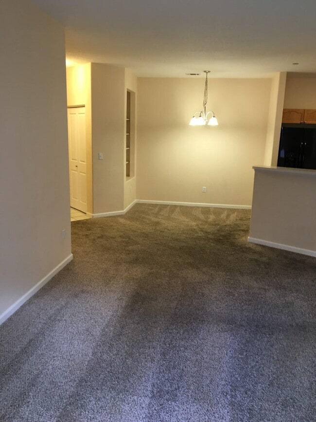 dining room with new carpet, paint, light fixtures - 7375 S Alkire St