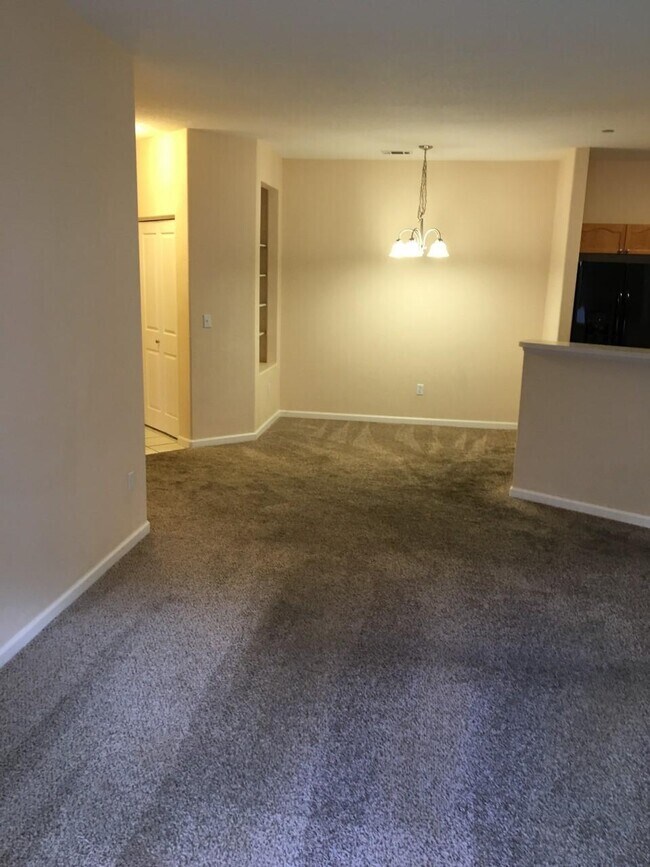 dining room with new carpet, paint, light fixtures - 7375 S Alkire St