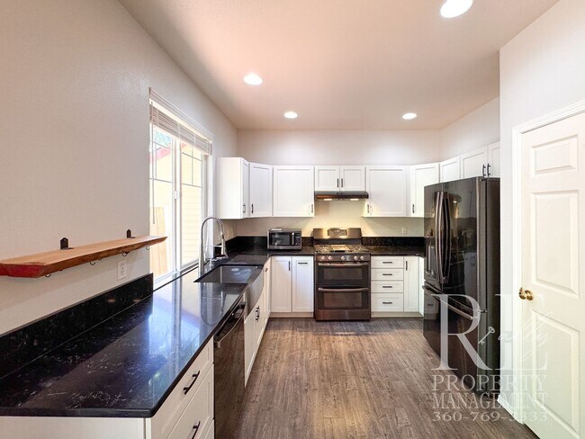 Building Photo - Dual Primary Suites, Huge Backyard Deck & Sun-Filled Living Spaces Near Everyday Conveniences