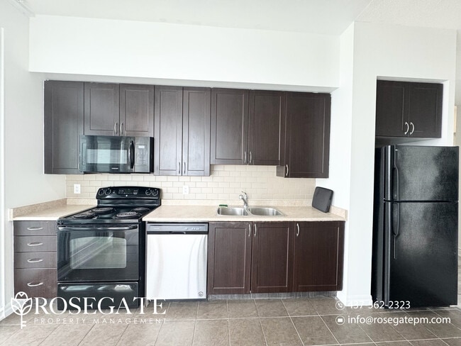 Building Photo - Newly Renovated 2-Bedroom Condo with 1.5 Baths – 800 Sq Ft