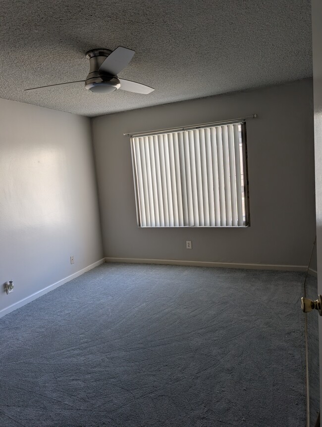 Bedroom with new carpet and fan - 215 Atlantic Ave