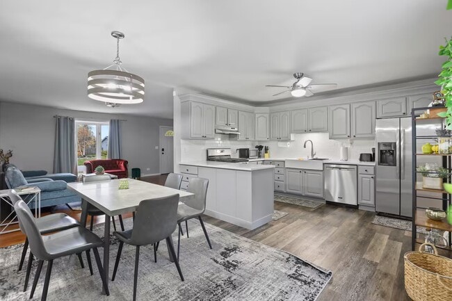 Dining area with fully stocked kitchen - 1002 Juniper Ln