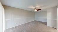 Located at 4500 Baymeadows Rd in Jacksonville, FL, this two-bedroom, one-bathroom unit offers a well-organized single-floor layout designed to maximize functionality. The galley-style kitchen is a standout feature, boasting granite countertops, crisp white cabinetry, stainless steel appliances including a refrigerator and range, a undermount sink with a matte black faucet, and light wood-look flooring that adds a clean, modern feel. Additional cabinet storage and counter space provide practical utility throughout. Both bedrooms are carpeted and feature ceiling fans with light fixtures, neutral-toned walls, and windows with blinds that allow for natural light. The primary bedroom offers a generous footprint, while the second bedroom provides comfortable accommodations. A dedicated closet adds valuable storage to the layout. The full bathroom includes a granite-topped vanity, a mirror, and a tiled shower-tub combination, maintaining the consistent, updated aesthetic found throughout the unit. A carpeted hallway connects the rooms seamlessly, with transitions to the kitchen's hard-surface flooring. Textured ceilings are present throughout, complementing the neutral color palette that gives the entire space a clean, move-in-ready appearance.