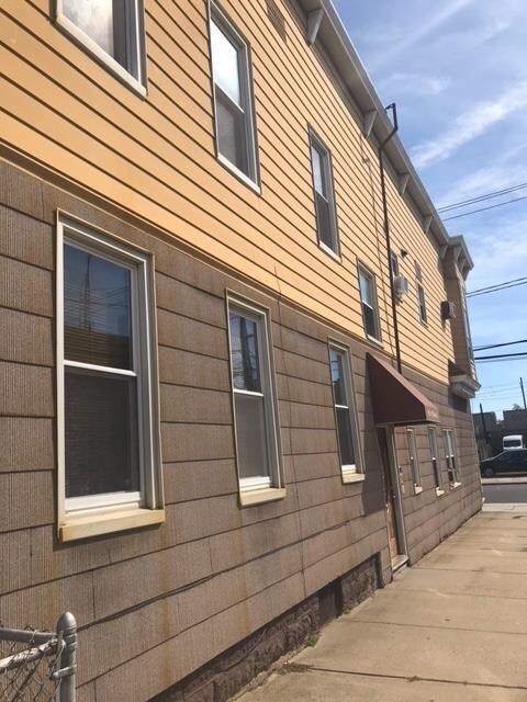 Building Photo - 115-117 AVENUE E