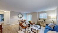 Embrace the opportunity to elevate your living experience in this beautifully designed 870 sq ft home. The spacious primary bedroom, measuring 200 sq ft, serves as your personal sanctuary, offering ample space for relaxation and rejuvenation. The home's open concept living area is a testament to contemporary design, featuring a stunning blue sofa that anchors the space, complemented by stylish leather accent chairs. Natural light floods the room through large windows, creating an ambiance of warmth and tranquility.

The kitchen, though compact, is a model of efficiency with modern appliances and ample storage, perfect for culinary enthusiasts. Both bathrooms showcase a blend of functionality and style, with wooden vanities and contemporary fixtures that add a touch of elegance to your daily routine.

Each of the three bedrooms is thoughtfully designed, with the primary bedroom boasting plush carpeting and a serene color palette that promotes restful nights. The home's cohesive design aesthetic, featuring a harmonious blend of blues, whites, and natural wood tones, creates a soothing atmosphere throughout.

Located in the desirable Belcamp area, this home at 1302 Liriope Ct offers not just a place to live, but a lifestyle to embrace. With its single-story layout and modern amenities, it's an ideal choice for those seeking comfort, style, and convenience. Don't miss this opportunity to make your dream home a reality.