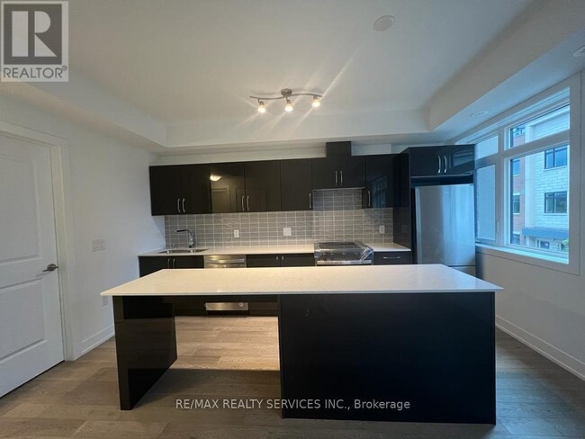 Building Photo - 1095 Douglas McCurdy Cmn