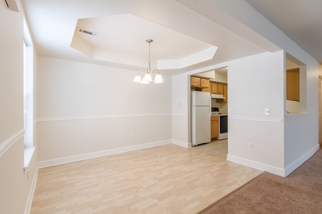 Lower apartment homes have charming tray ceilings in the dining area. - Jordache Park Apartments