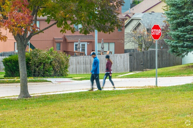 Residents of Bellevue stroll the quiet neighborhood streets.