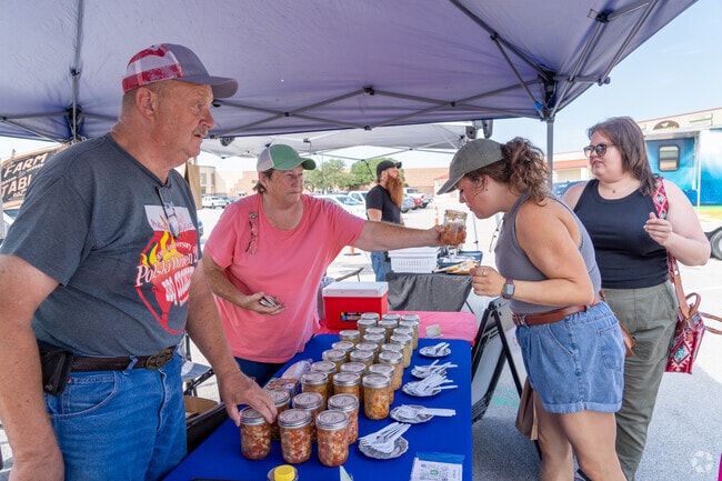 Aggieland Farmers Market guests savor the aroma of homemade chow chow.