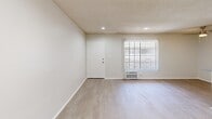 Located at 7519 Vassar Ave in Canoga Park, CA, this one-bedroom, one-bathroom unit offers a practical and efficient single-floor layout designed to maximize every square foot of living space. The open-concept living room features recessed lighting, a textured ceiling, light wood-style flooring, and a large window dressed with vertical blinds that invites natural light and views of surrounding greenery. A wall-mounted climate unit provides comfort year-round. The galley-style kitchen is thoughtfully laid out with white cabinetry, granite-look countertops, a gas range, a refrigerator, and a single-basin sink — offering everything needed for everyday cooking in a compact, organized space. The bedroom is a comfortable retreat, highlighted by a ceiling fan with integrated lighting, a sliding closet, and a bright window with vertical blinds that frames outdoor foliage. Light wood-style flooring continues throughout, lending a cohesive and clean aesthetic. The bathroom features a combined tub and shower unit in a crisp white finish, complemented by matching flooring. Neutral tones and clean finishes throughout the unit create a bright, move-in-ready environment suited for comfortable everyday living in the heart of Canoga Park.