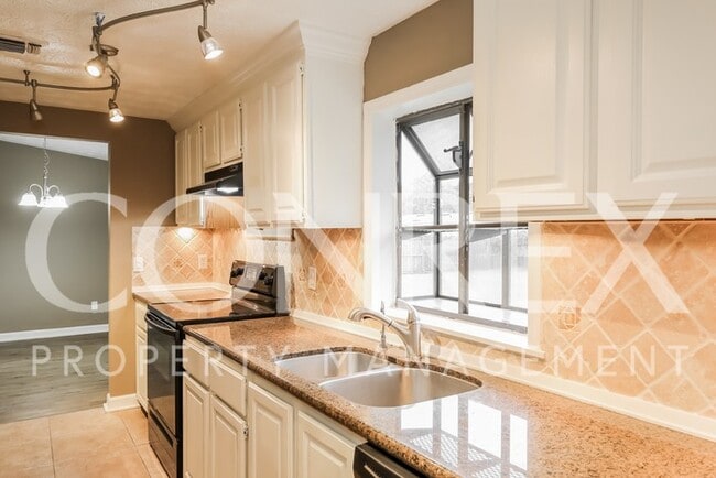 Building Photo - Charming Four Bedroom with Modern Upgrades