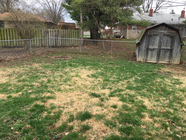 Fenced in backyard and storage barn - 5922 W 16th St