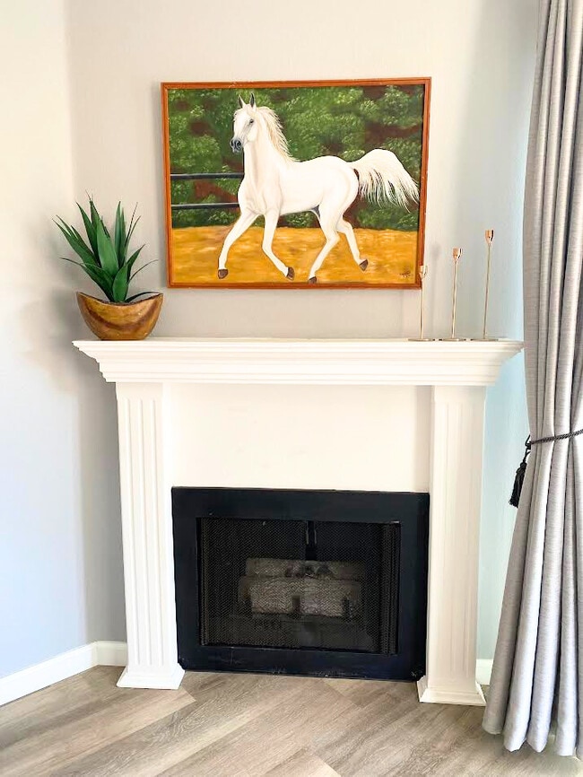 Gas Fireplace with white mantle. Feel free to decorate your space for the holidays! This is the per - 220 Woodland Pky