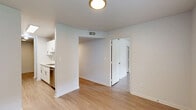 Located at 4247 5th Ave in Lake Charles, Louisiana, this single-floor 2-bedroom, 2-bathroom unit offers a thoughtfully laid-out interior with a consistent, modern aesthetic. Light wood-style flooring runs throughout the entire space, lending a bright and cohesive feel to every room.

The living area is open and airy, flowing directly into the galley-style kitchen. The kitchen is well-equipped with white shaker cabinetry featuring brushed nickel hardware, white countertops, a stainless steel refrigerator, an electric range, a dishwasher, and a double basin sink — offering ample storage and functionality in a clean, efficient layout.

Both bedrooms are comfortably sized, each featuring ceiling fans with light fixtures, windows with blinds that invite natural light, and easy access to hallways connecting the rest of the unit. The primary bedroom includes a dedicated closet for added storage.

The two bathrooms mirror each other in design, each outfitted with a single-sink vanity with white cabinetry, a large mirror with overhead lighting, a full soaking tub with a shower, and the same light wood-style flooring found throughout the unit.

The overall ambiance is clean, neutral, and move-in ready, with a modern yet understated design suitable for comfortable everyday living.