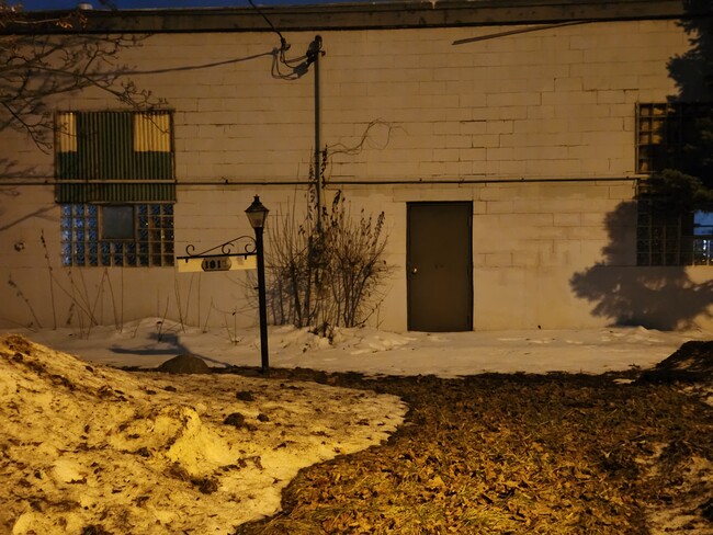 Henry St. (back door) - 210 W Cecil St