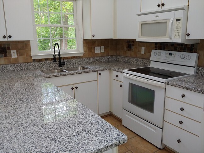 Kitchen with new granite counter tops and new faucet - 808 Clayton Rd