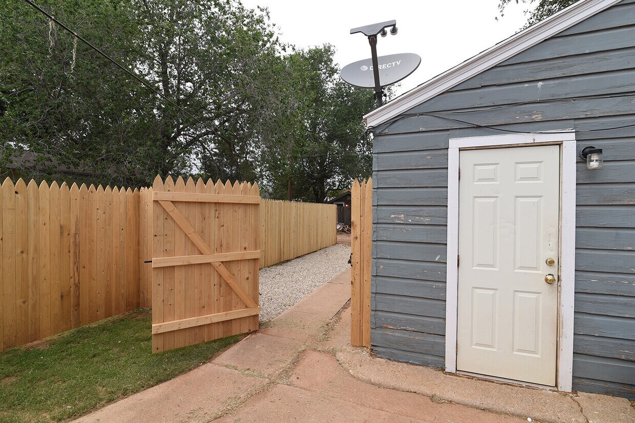 Primary Photo - Rear Home Nestled In Texas Tech and Downto...