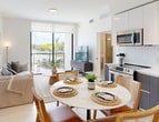This contemporary 870 square foot apartment in Miami Gardens offers a harmonious blend of style and functionality. The open-concept layout seamlessly integrates the kitchen, living, and dining areas, creating a spacious feel. The kitchen boasts sleek two-tone cabinetry, stainless steel appliances, and a convenient dining area.

The living room is bathed in natural light from floor-to-ceiling windows, leading to a balcony with scenic views. Modern furnishings and artistic decor enhance the space's aesthetic appeal. The primary bedroom, measuring 180 square feet, features a minimalist design with ample storage and stylish accents.

Three well-appointed bathrooms showcase modern fixtures, including floating vanities and glass-enclosed showers. The apartment's neutral color palette, predominantly whites and grays, creates a calm and cohesive ambiance throughout.

Additional amenities include central air conditioning, in-unit laundry, and two closets for extra storage. The property's thoughtful design maximizes the use of space, making it an ideal urban dwelling for those seeking comfort and contemporary living in Miami Gardens.
