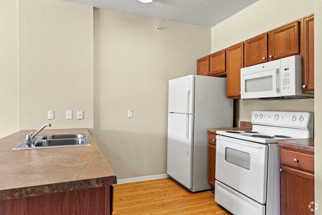 1BR, 1BA - 714SF - Kitchen - Mariposa at Hunter Road 55+ Apartment Homes