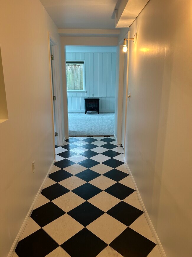 Hallway between living room to kitchen/dining and bedroom/bathroom & 2 other storage closets - 908 NW 105th St