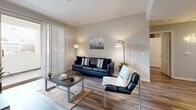 Located at 3770 S Figueroa in Los Angeles, CA, this well-appointed two-bedroom, two-bathroom residence is thoughtfully designed across a single floor. The open-concept layout seamlessly connects the kitchen, dining area, and living room, creating an inviting and functional shared space. The kitchen is fitted with crisp white shaker cabinetry, white quartz countertops, stainless steel appliances including a gas range, microwave, and refrigerator, and a peninsula that offers additional prep and seating space. A dedicated pantry provides generous storage. Wood-style flooring flows throughout the main living areas, lending warmth and visual continuity. The living room is bright and airy, benefiting from natural light and sliding door access to an outdoor area with greenery views. Both bathrooms feature tub-shower combinations with sliding glass doors, white vanities, and wood-style tile flooring. One bathroom includes a glass block window for added natural light. The spacious primary bedroom offers a comfortable retreat, while the second bedroom is well-suited for a guest room or home office. Six closets throughout the residence ensure ample storage. The overall ambiance is clean, modern, and light-filled, making it an ideal home in the heart of Los Angeles.