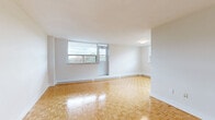 Located at 105 Rowena Dr in Toronto's M3A neighbourhood, this 2-bedroom, 1-bathroom unit offers a functional and well-maintained layout across a single floor. Warm parquet flooring runs throughout the living areas and both bedrooms, adding a classic character to the clean, neutral interiors defined by white walls and crisp trim.

The spacious living room is filled with natural light through a large window that frames views of the surrounding greenery and neighbourhood. Baseboard heating runs along the perimeter, ensuring year-round comfort. The primary bedroom is generously sized, featuring its own large window with neighbourhood views, while the second bedroom also benefits from natural light and includes a built-in double closet for practical storage.

The kitchen area is tiled in a bright marble-look finish that continues seamlessly into the bathroom. The renovated bathroom is a standout feature, showcasing marble-patterned floor and wall tiles, a soaker tub with an elegant tiled surround, and a clean white vanity with modern hardware.

A hallway connects all rooms with ease, giving the unit a logical and efficient flow. With its refreshed finishes, abundant natural light, and well-proportioned rooms, this unit offers a comfortable and practical living space in a residential Toronto neighbourhood.