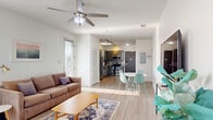 Located at 1014 18th Ave S in Nashville's vibrant 12South neighborhood, this well-appointed 2-bedroom, 2-bathroom unit offers a clean, modern aesthetic across a thoughtfully designed single-floor layout. Light wood-style flooring flows seamlessly throughout, complementing the crisp white walls and creating a bright, cohesive ambiance.

The kitchen is a functional standout, featuring gray shaker-style cabinetry, granite countertops, a subway tile backsplash, and a full suite of stainless steel appliances including a refrigerator, range, microwave, and dishwasher. Track lighting and a window add both utility and natural light to the space.

The spacious living area benefits from multiple windows fitted with blinds, a ceiling fan, and generous natural light that gives the room an open, airy feel. A glass-paned exterior door provides additional light and outdoor access.

Both bedrooms are comfortably sized with large windows offering outdoor views, wood-style flooring, and ample closet space. The primary bedroom connects to a secondary living or sitting area, adding flexibility to the layout.

The two bathrooms are clean and functional, each featuring a vanity with storage, toilet, and shower or tub combination, finished with light, neutral tones consistent with the rest of the unit's modern style.