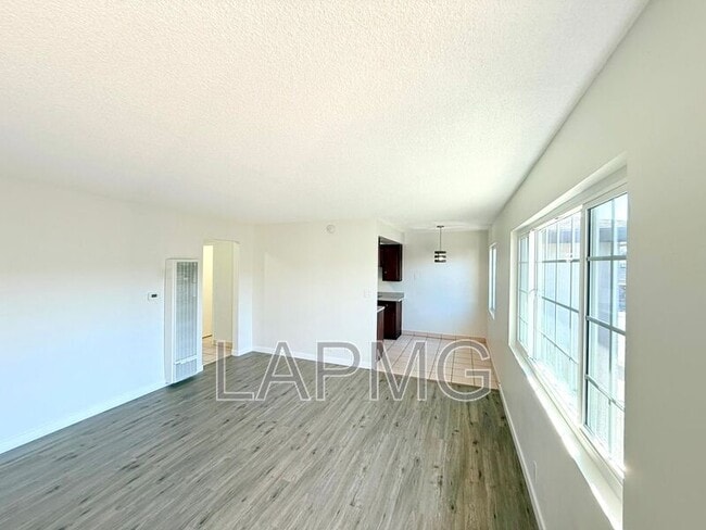 Photo - 7039-7039 Miles Ave House